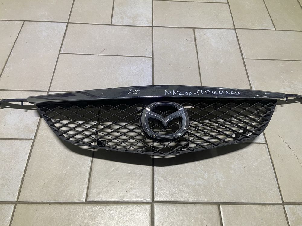 Решетка радиатора Mazda Primasi