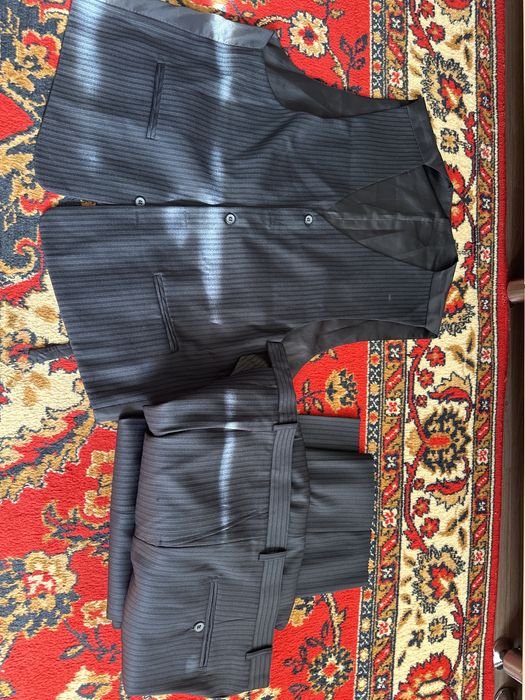 Продам брючный костюм тройку (новый)