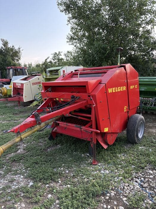 Presa de balotat , balotiera rotundă Claas Rollant 46 , Welger , Deutz