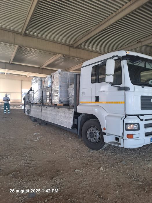 Transport materiale construcții cu macara