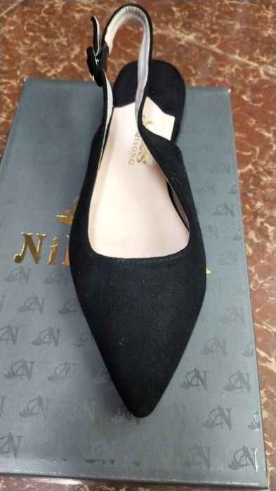 Босоножки . Новые.