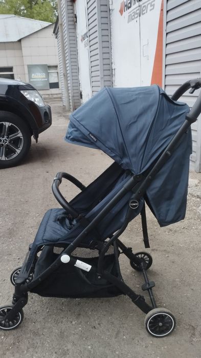 Продам детскую прогулочную коляску TOMIX