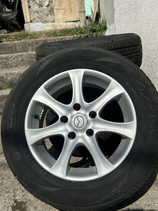 4бр. Алуминиеви джанти с гуми 195/65 R15 цола от Mazda