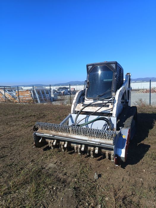 Bobcat senilat cu tocator vegetal - forestier