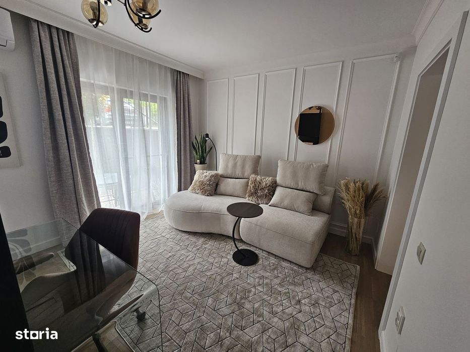 Apartament modern cu grădină superbă și parcare acoperită