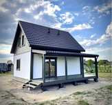 Executam la cerere case din lemn metal