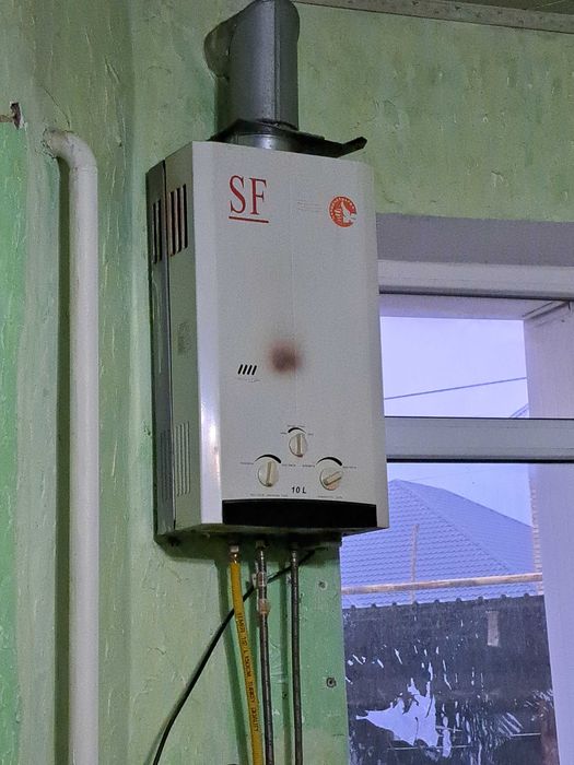 Газовый колонка.