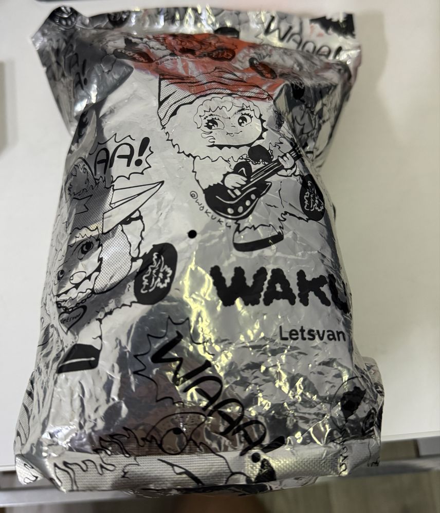 Игрушка брелок wakuku оранжевого цвета .