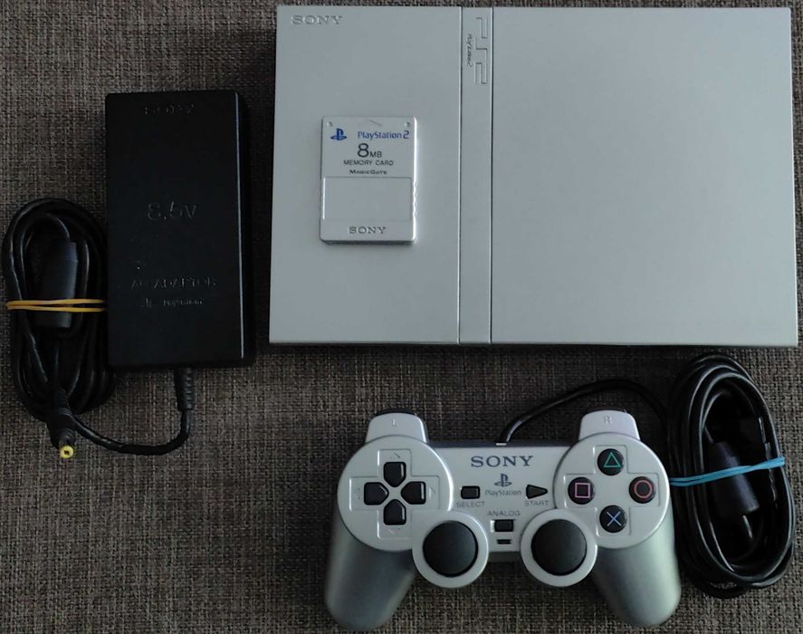 PlayStation 2 slim model deosebit argintiu modat 33 jocuri,maneta