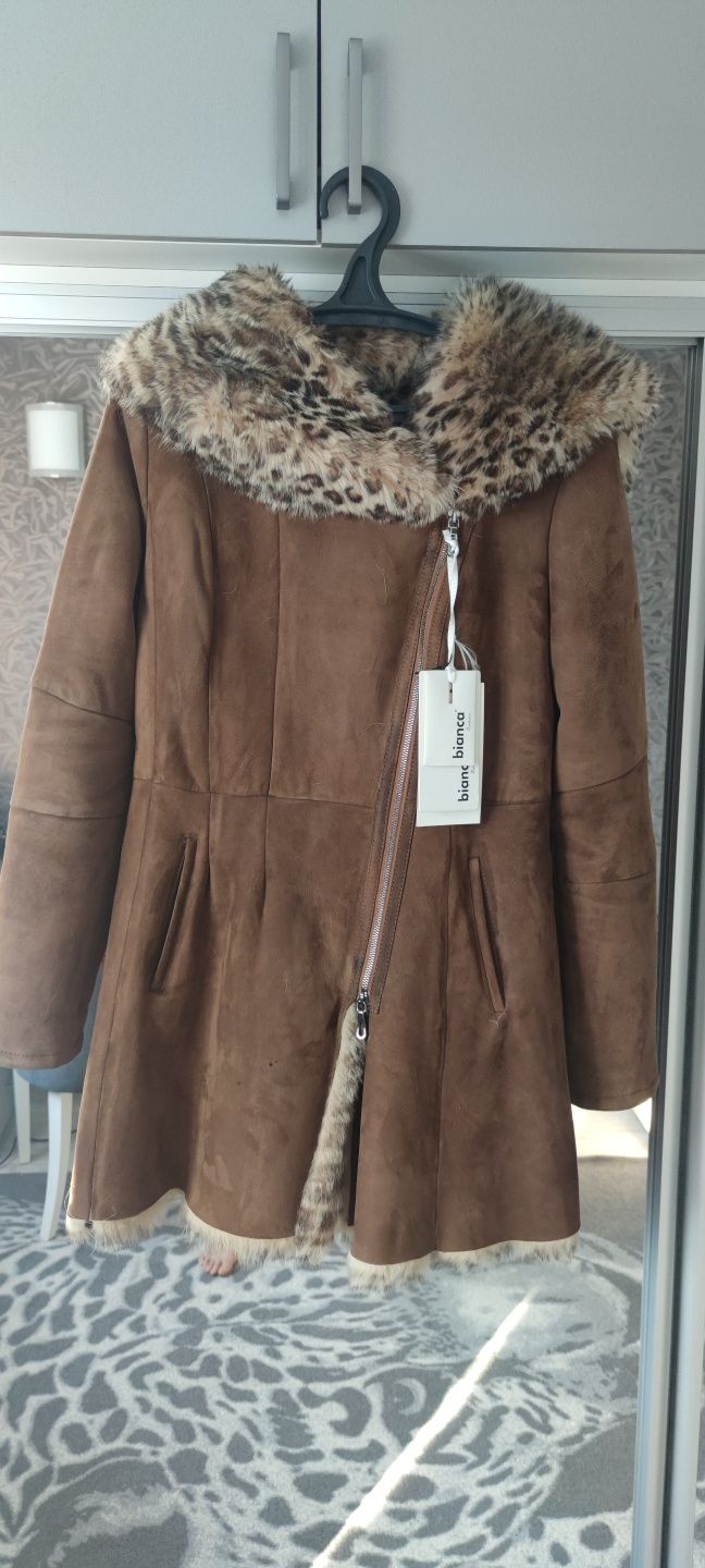 Продам дубленку новую