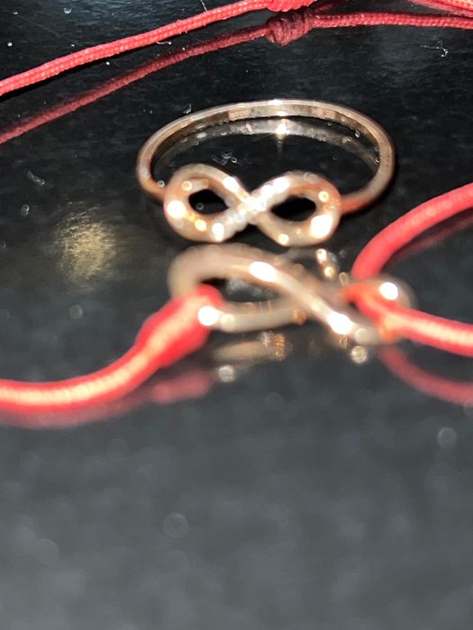 Продам оригинальный золотой комплект бесконечность