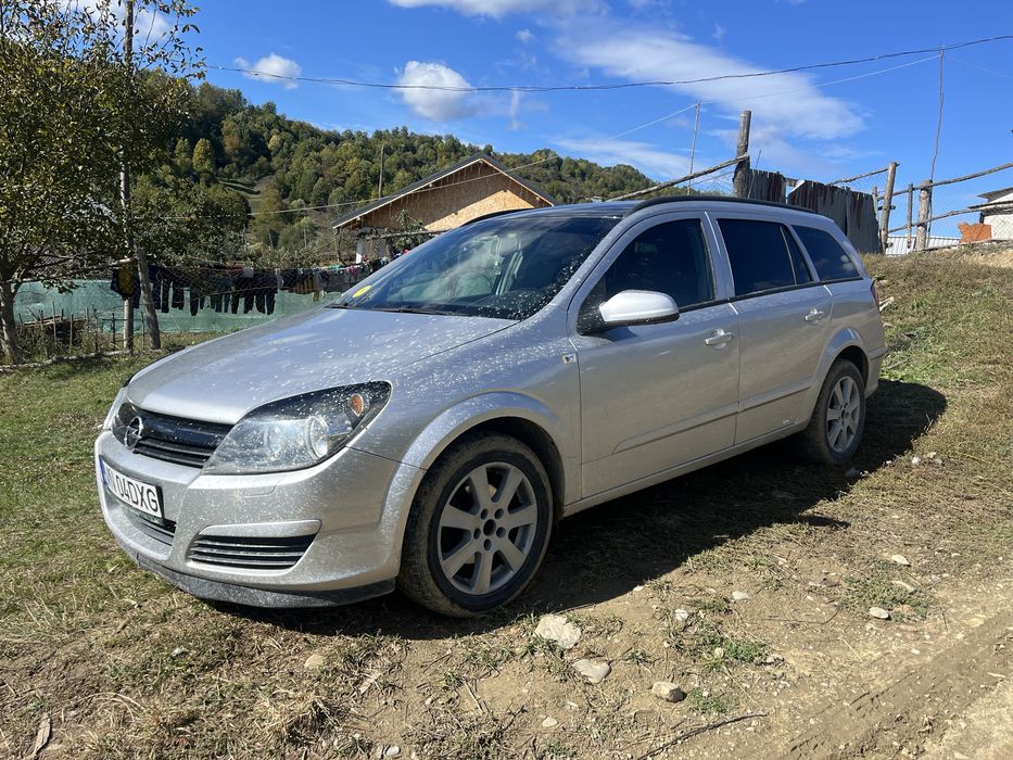Vand sau schimb opel asta h  pret :2300€