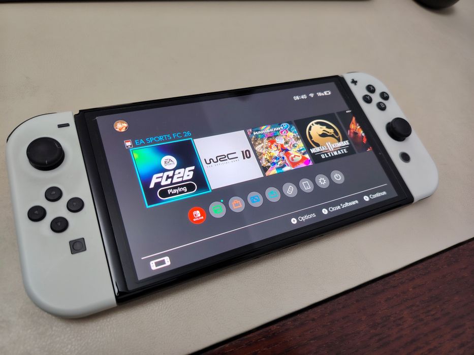 Nintendo Switch OLED + FC 26 + 4 jocuri
