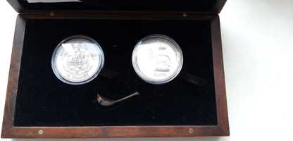 Серебряные коллекционные монеты (10 долларов и 10 франков).