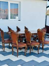 Masa din lemn masiv cu opt scaune din piele