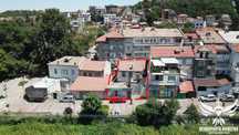 Продавам двуетажна къща с магазини 198РЗП гр.Асеновград, топ център