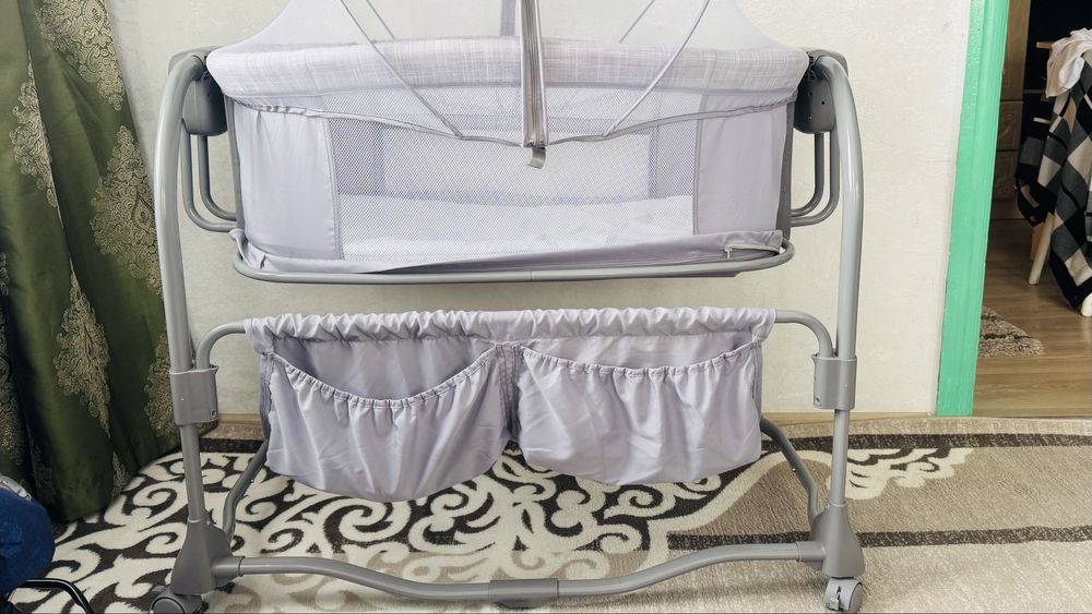 Кішкене балаға арналған төсек, электрлі, бірнеше функциялары бар