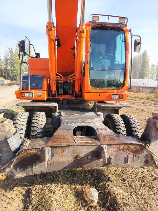 Доосан колёсный эксковатор 210 инжектор матор сотилади холати яхши