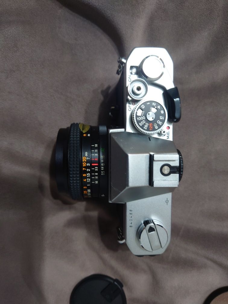 SLR Konica Autoreflex T3 (N} cu obv Hexar AR 28mm
