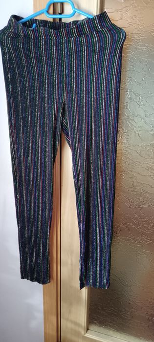 Pantaloni eleganți cu sclipici elastici multicolor purtați o singura d