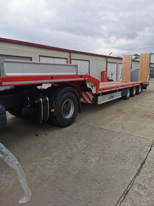 Fliegl SDS 470T Semiremorca trailer fix cu 3 axe rampe hidraulice 47000 kg Fliegl