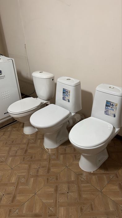 Унитазы новые.