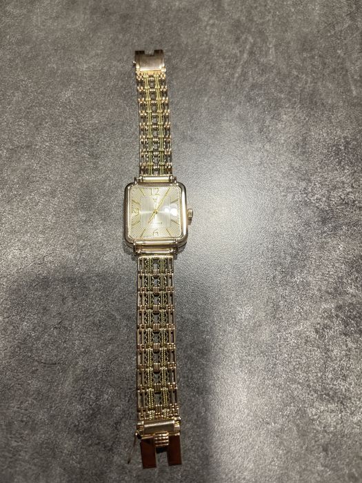 часы золотые ника