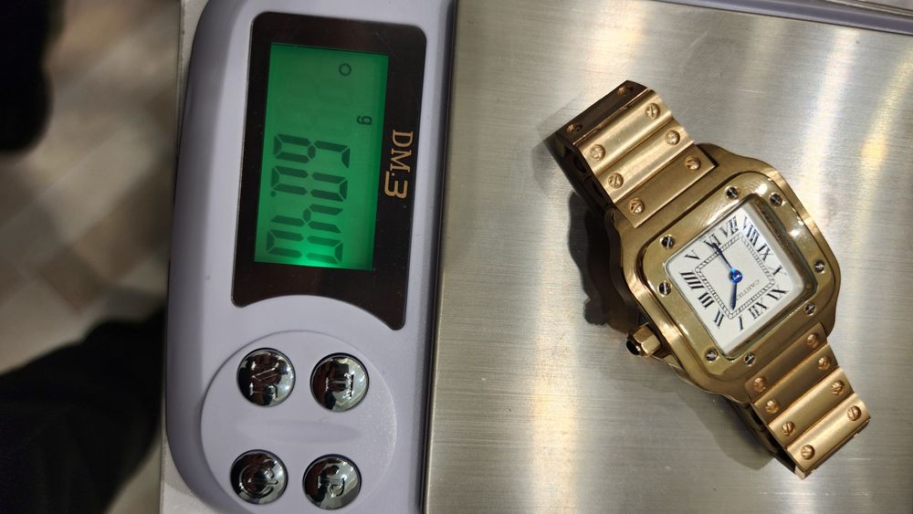 Золотые часы Cartier Santos