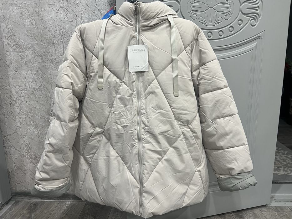Продам зимний пуховик женский