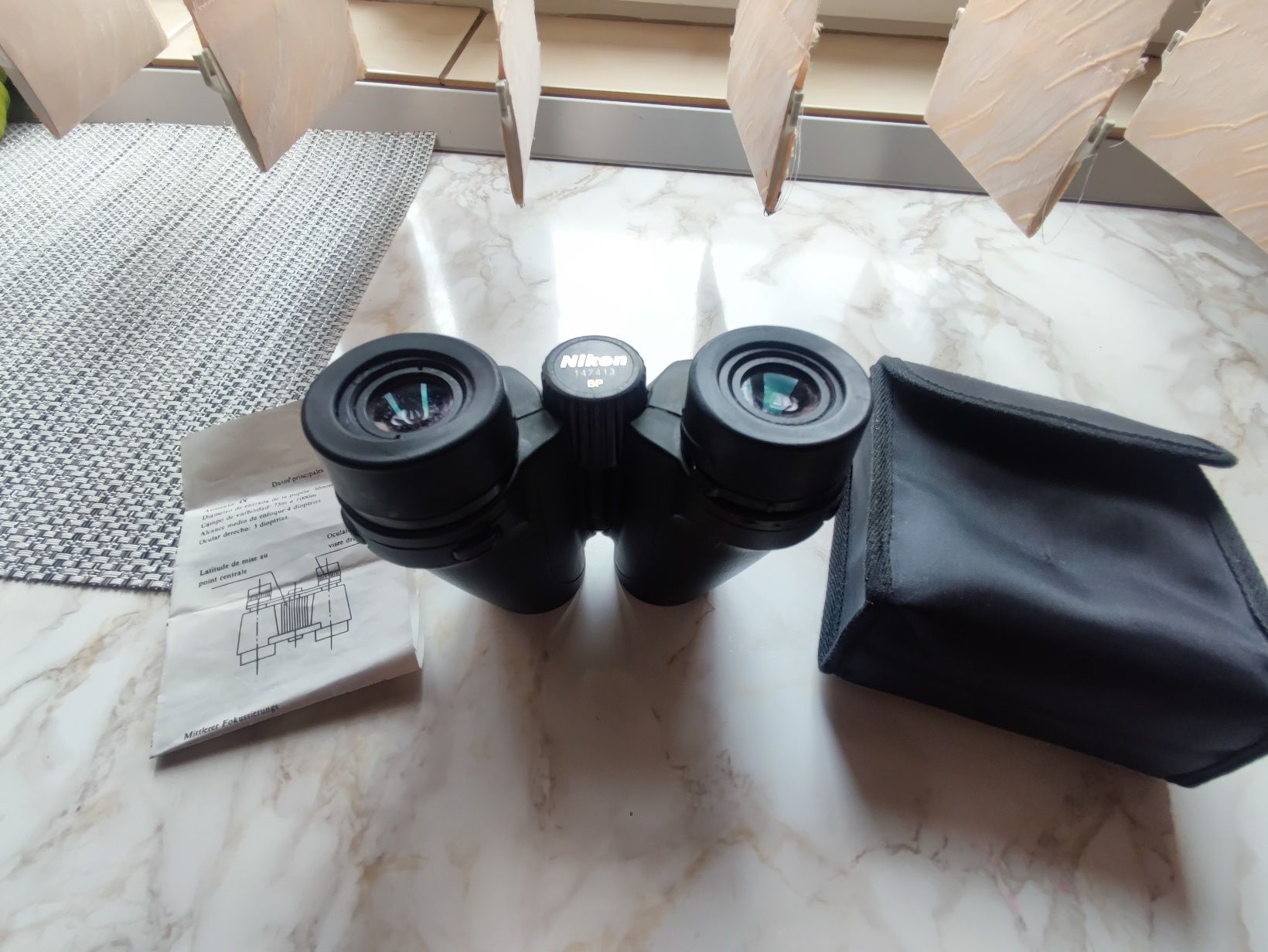 BINOCLU NIKON 
Detalii conținut