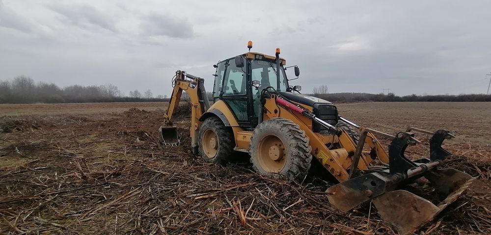 Caterpillar 444 E buldoexcavator buldo