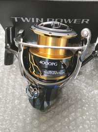 Продам    новую  катушку Shimano Twin Pawer 4000PG и twin 24 4000m