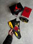 Air Jordan 4 Retro “Yellow Thunder”