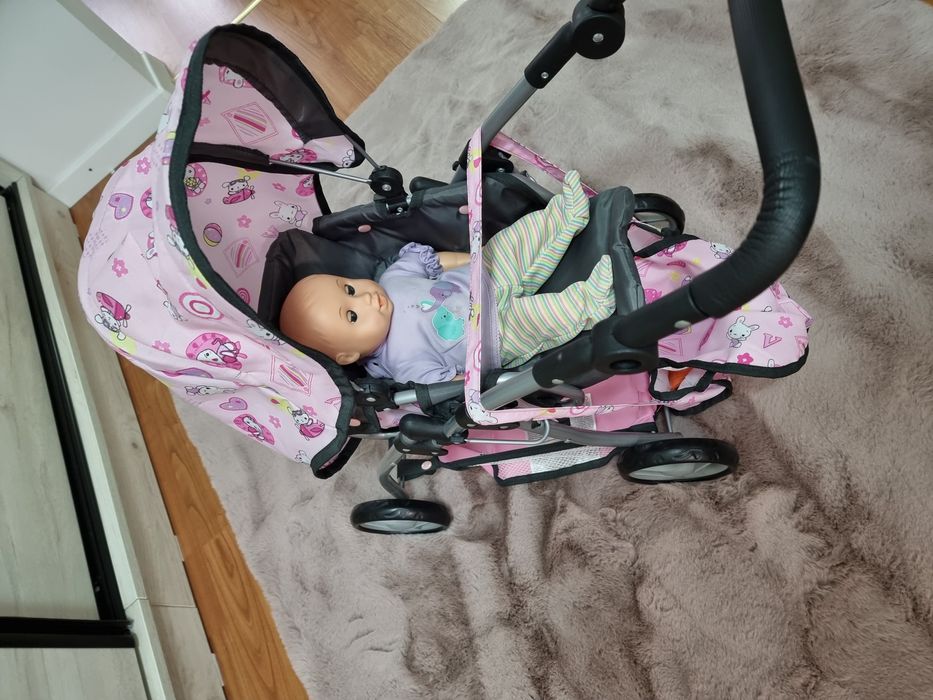 Carucior de jucarie +geanta + bebe