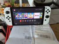 Nintendo Switch Oled in garanție + 2 jocuri Super Mario Bros