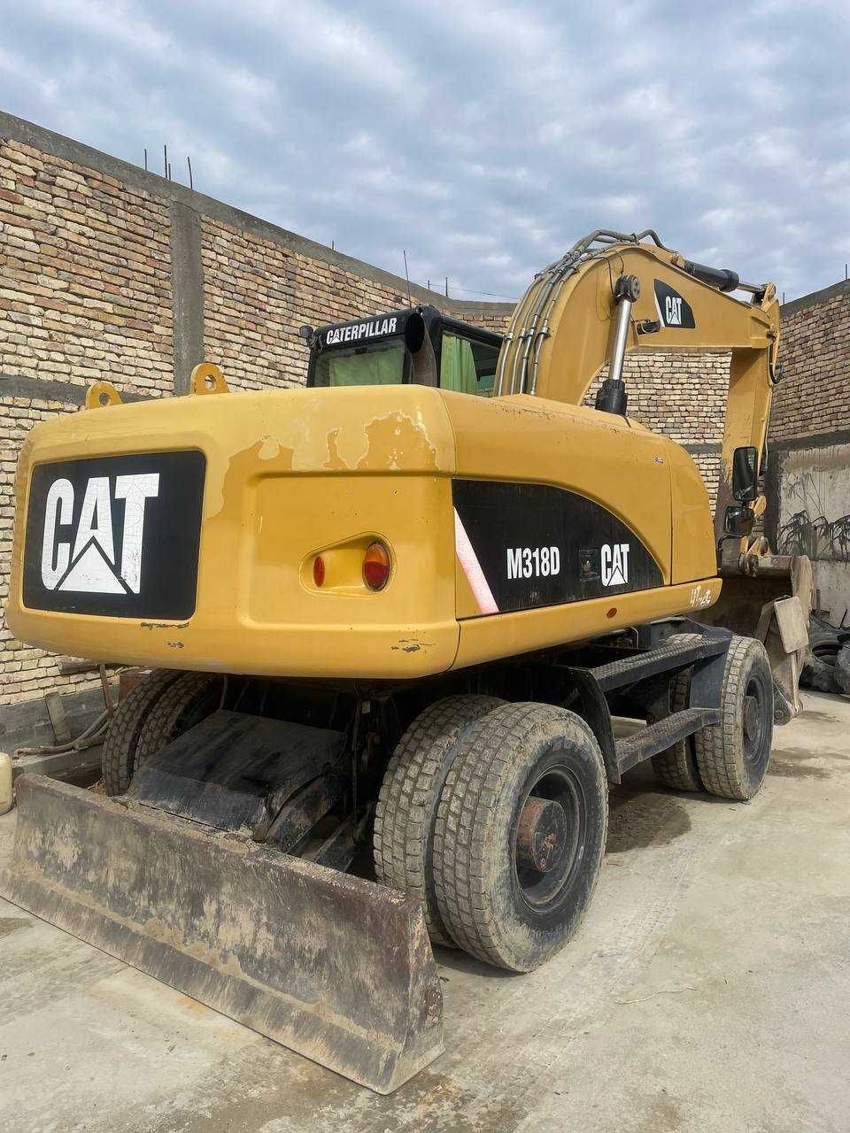 Колесный экскаватор CAT M318D