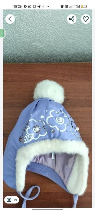 Продам зимнюю шапочку для девочки