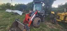 Buldoexcavator bx300c.