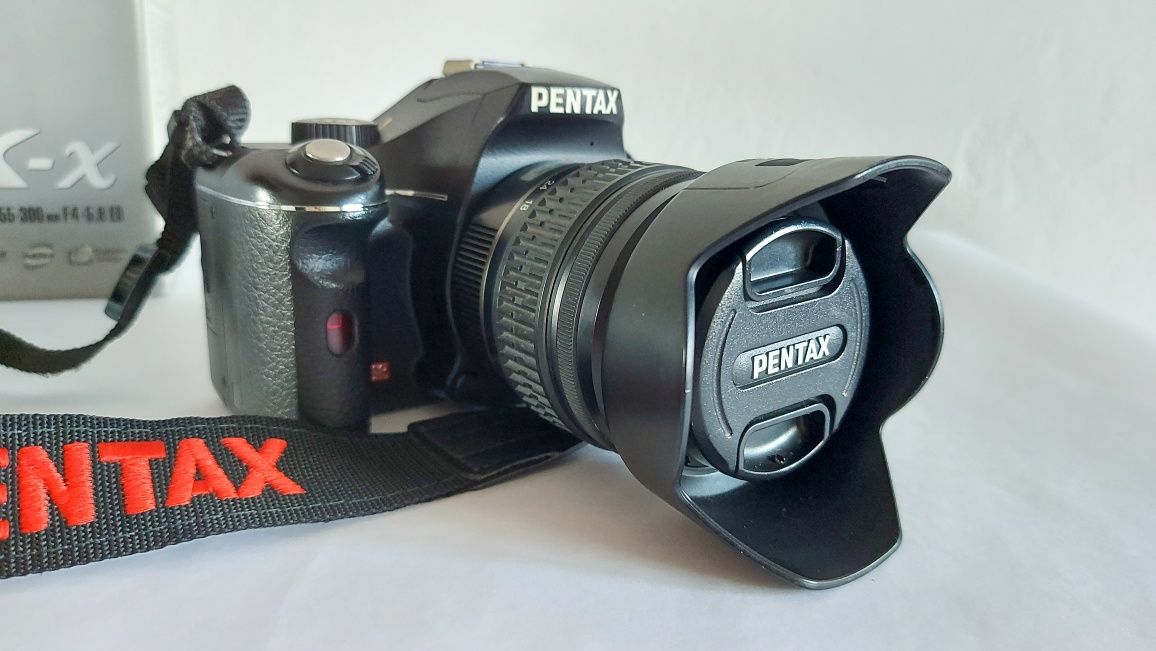 Pentax k-x , объектив 18-55 kit и объектив  pentax 50mm 1.4