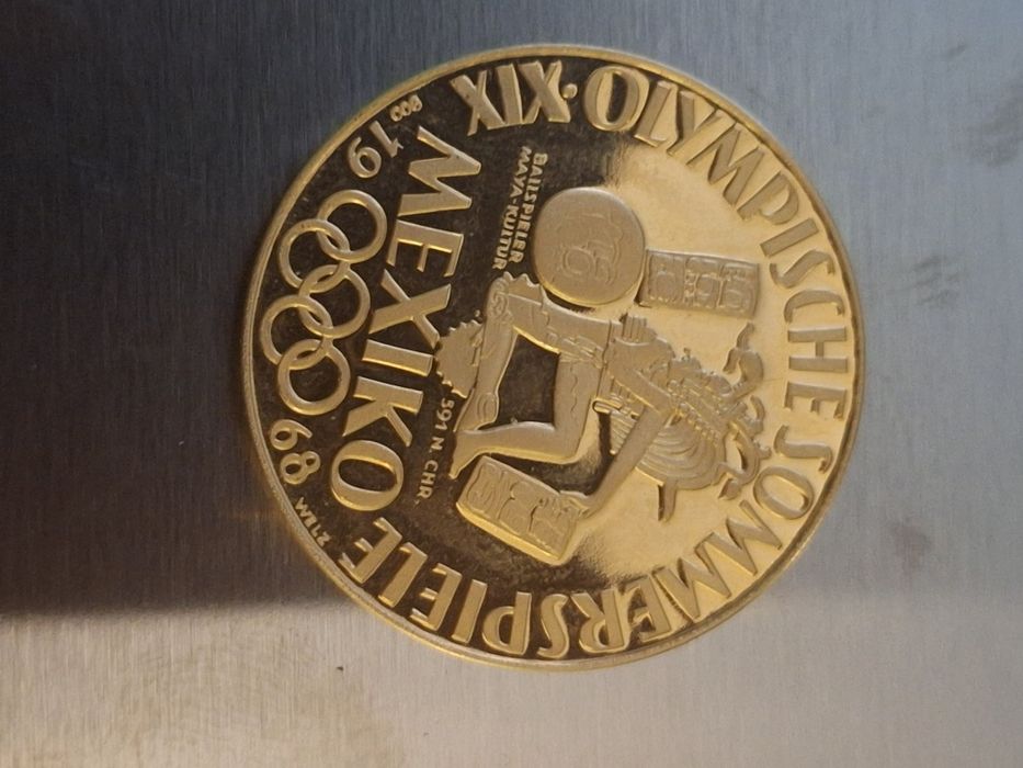 Vând doua monede aur 100 dolari canada și medalie aur jocurile olimpic