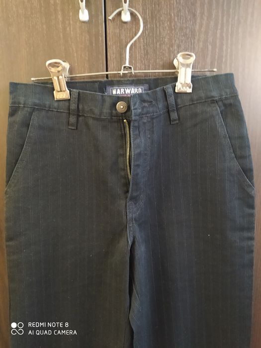 Джинсы новые темного цвета