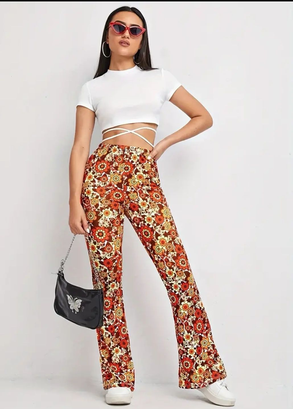 Pantaloni cu talie înaltă și imprimeu floral, model evazat