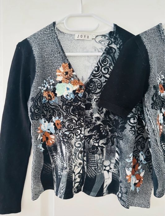 Set cardigan și bluză cu mânecă scurtă din 50% lână merinoz.