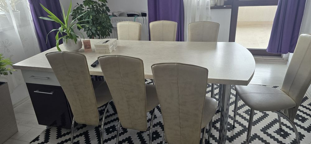 Masa mare cu 8 scaune +2 noptiere cu sertare, blat termorezistent.