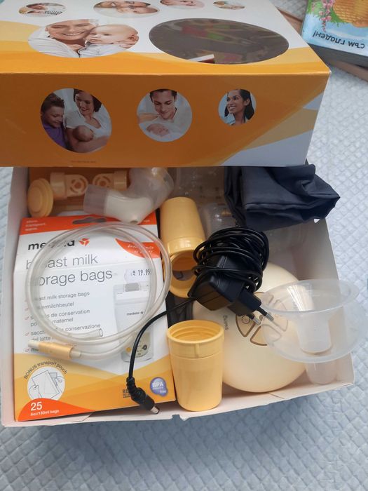 Ел. помпа за кърма Medela + торбички за кърма + резервни клапи