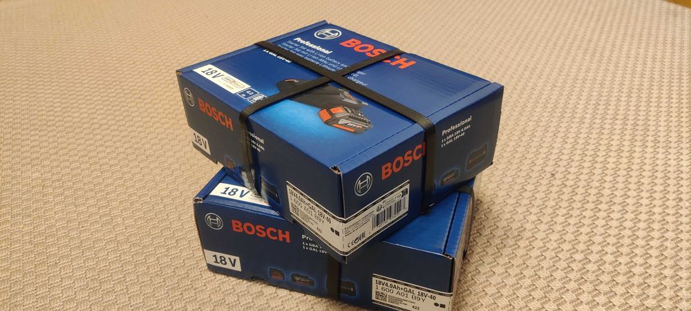 Cutie sigilata Set incarcator 4A + acumulator Bosch 18V 4Ah, original.