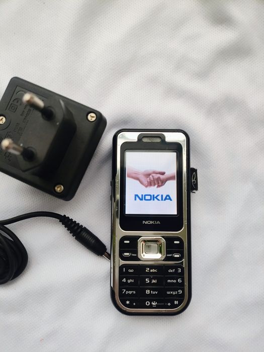 Nokia 7360 + incarcator original ( decodat, stare foarte buna)