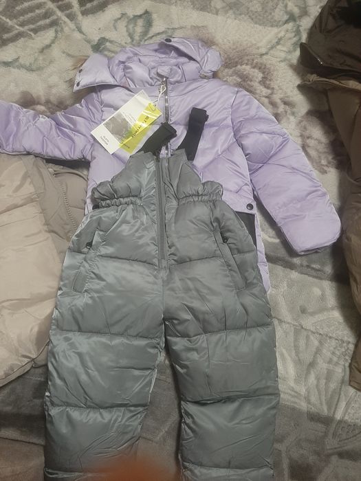 Продам новый комбинезон куртку