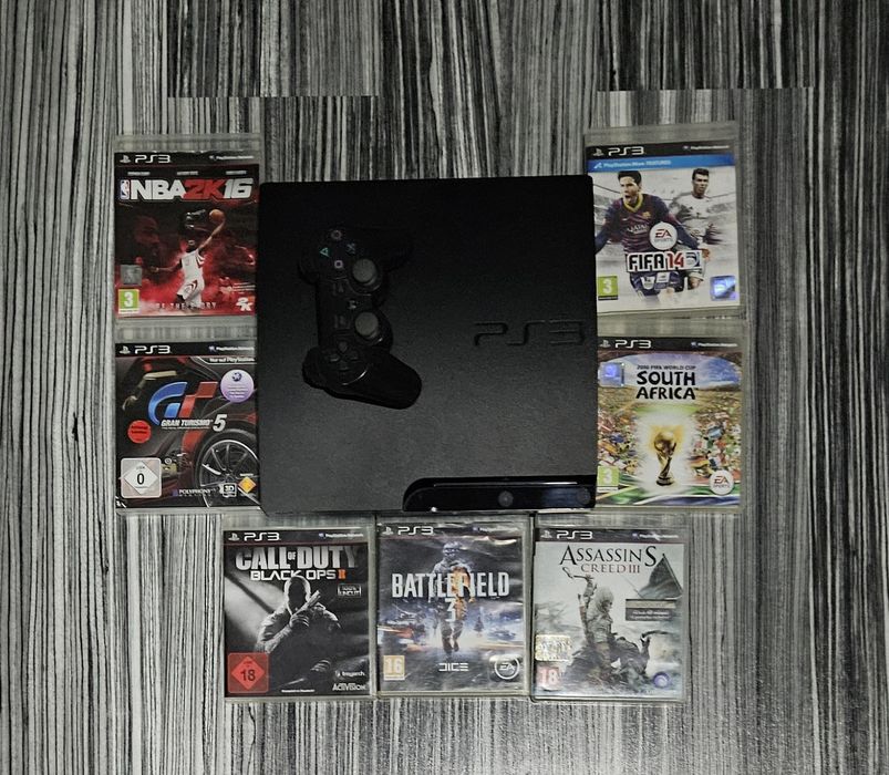 Consola ps 3 slim +7  jocuri originale