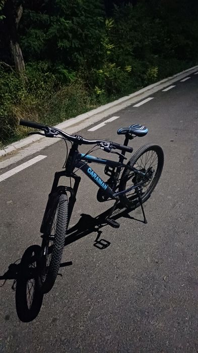 Vând Bicicletă cu discul de pe spate îndoit